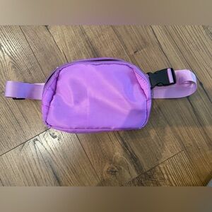Purple nylon crossbody bag with black accents